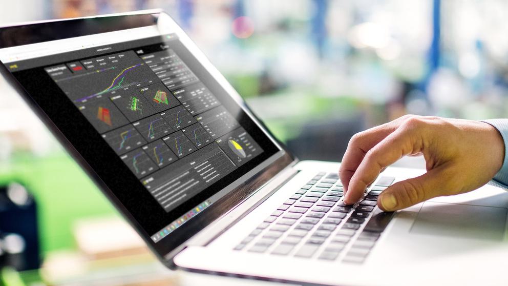 Standing holding laptop dashboard home page crop